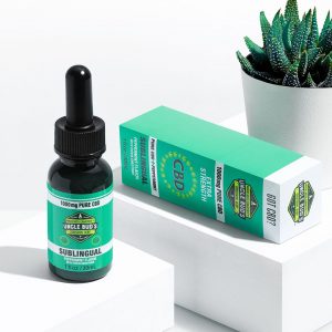 Bottle of Uncle Bud's 1000mg CBD sublingual tincture and product boxbox.