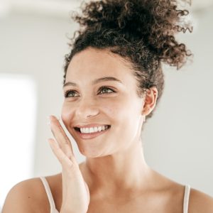 woman using products to tone and tighten skin